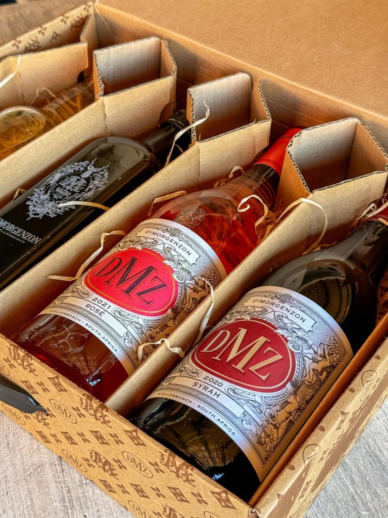 A box with three bottles of wine in it